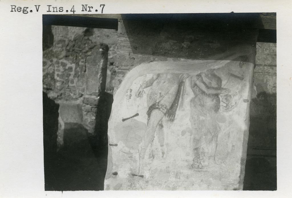 V.4.7 Pompeii. Pre-1937-39. Remains of painting of Bacchus and Silenus.
Photo courtesy of American Academy in Rome, Photographic Archive. Warsher collection no. 677.
Kuivalainen describes –
A composition of two figures facing opposite directions on a light background. On the left, a youth stands with his weight on his right foot; he wears a reddish cloak, which hangs down from the left side and covers only the left thigh, revealing his genitals, and high boots; in his right hand he holds an object and leans with his left arm on a shorter Silenus. He wears a cloak that covers the lower part of his body; his skin is darker, and he plays the cithara, holding it with his left hand. Above them grows a vine.
Kuivalainen comments –
A young almost naked Bacchus with Silenus playing the cithara is a common motif. The object in the youth’s hand may have been a cantharus, and there may have been a panther as well.
See Kuivalainen, I., 2021. The Portrayal of Pompeian Bacchus. Commentationes Humanarum Litterarum 140. Helsinki: Finnish Society of Sciences and Letters, (F8, p.164).