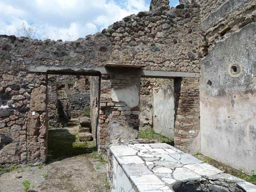 V.4.7 Pompeii. May 2010. Looking north from bar room to rear rooms.