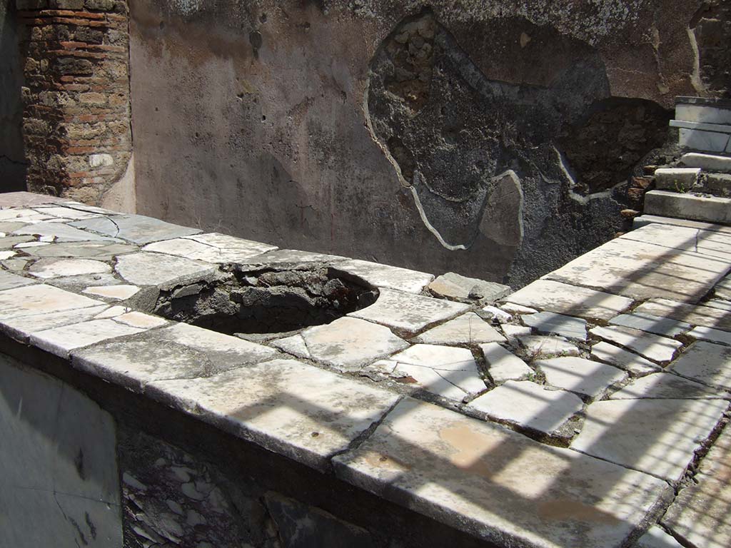 V.4.7 Pompeii. May 2006. Top of marble counter.