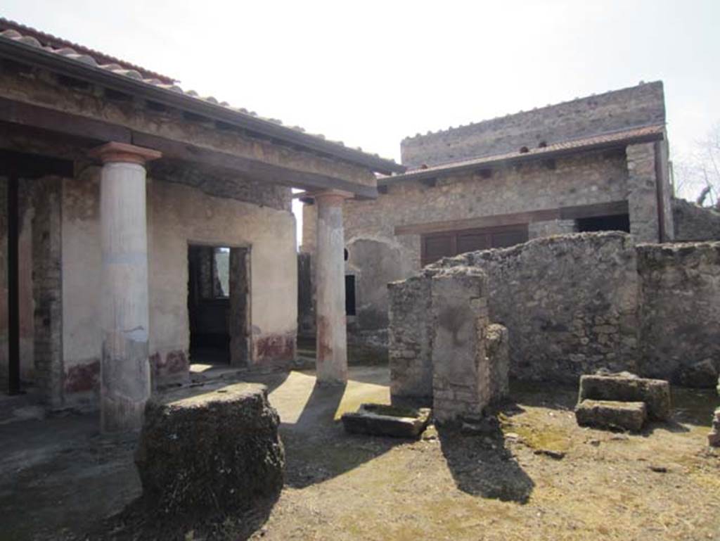 V.4.a Pompeii. March 2012. Looking towards doorway to summer triclinium (centre left) at west end of garden area.
The remains of the kitchen area can be seen on the right, and photos are also to be found in our Garden area pages. 
Photo courtesy of Marina Fuxa.