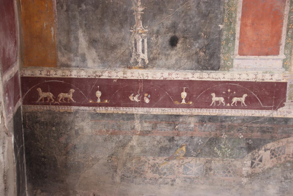 V.4.a Pompeii. October 2023. 
Room ‘h’, painted violet predella above black zoccolo on north wall at west end. Photo courtesy of Klaus Heese.