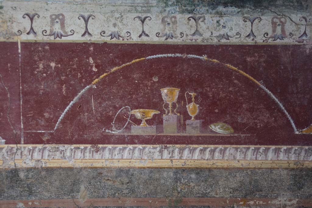 V.4.a Pompeii. March 2018. Room ‘h’, detail from painted predella on north wall on east side of central panel.
Foto Annette Haug, ERC Grant 681269 DÉCOR.