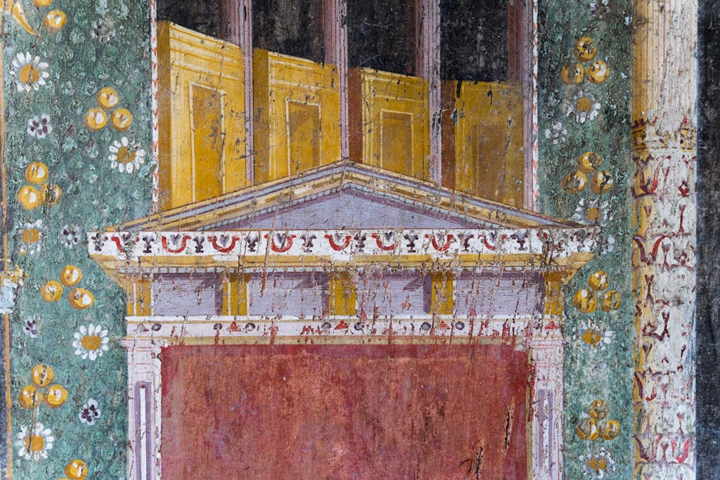 V.4.a Pompeii. January 2023. 
Room ‘h’, painted detail from the upper part of the separating panel on east end of south wall. Photo courtesy of Johannes Eber.