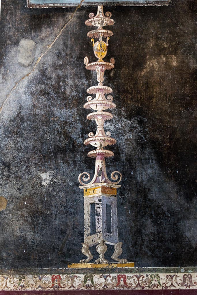 V.4.a Pompeii. January 2023. 
Room ‘h’, painted decoration below small panel at west end of south wall.
Photo courtesy of Johannes Eber.