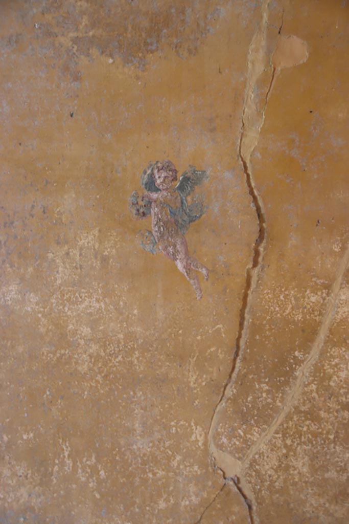 V.4.a Pompeii. October 2023. 
Room ‘i’, figure at west end of south wall of cubiculum. Photo courtesy of Klaus Heese.