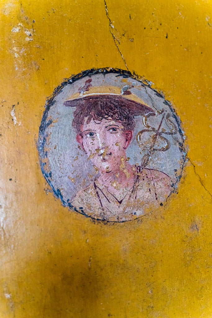 V.4.a Pompeii. January 2023. 
Room ‘i’, wall painting of boy from west wall of cubiculum, on north side of doorway. 
Photo courtesy of Johannes Eber.