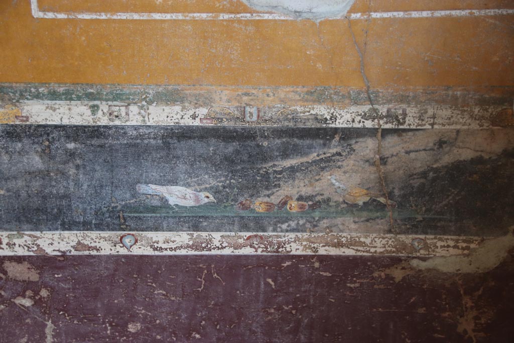 V.4.a Pompeii. October 2023. 
Room ‘g’, painting of birds in predella, above lower north wall in north-east corner. Photo courtesy of Klaus Heese.