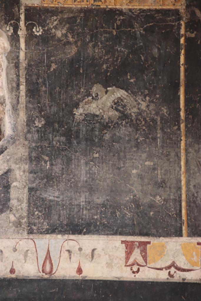 V.4.a Pompeii. October 2023. 
Room ‘b’, detail from panel on upper east wall in south-east corner. Photo courtesy of Klaus Heese.