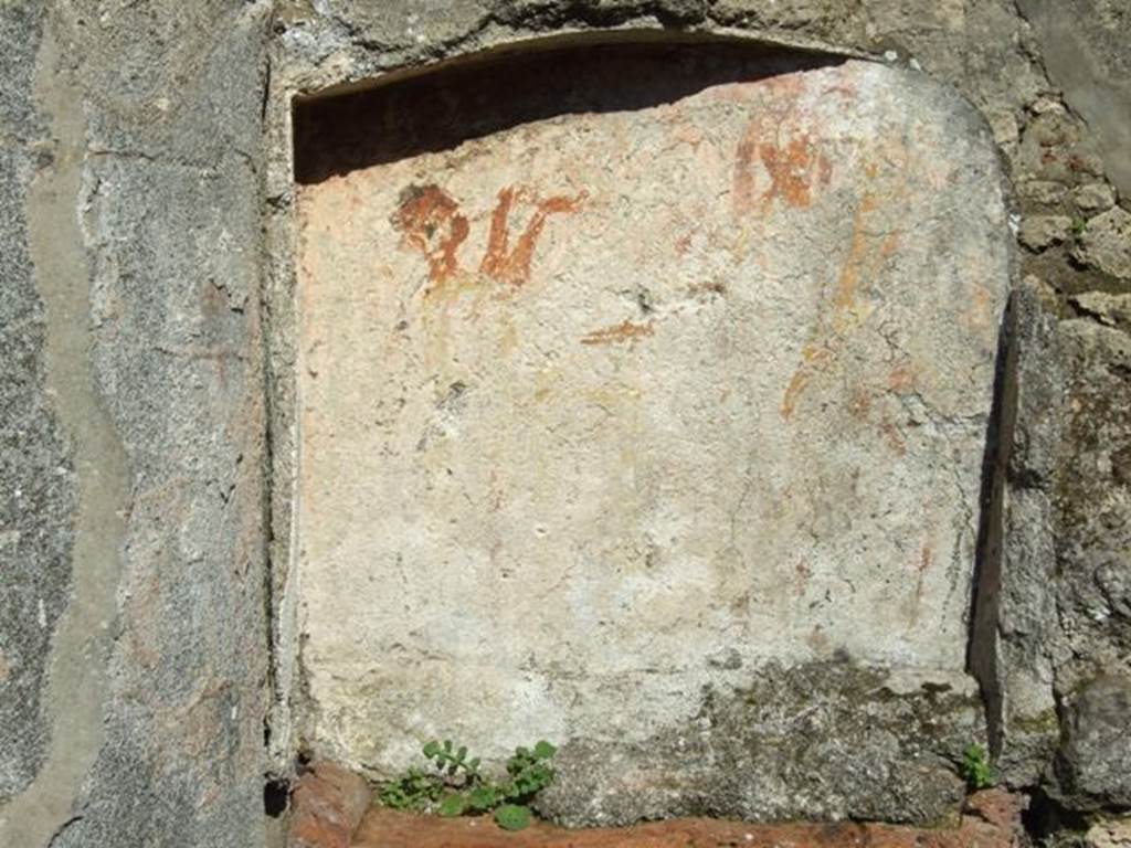 V.4.b Pompeii. March 2009. Painted Lararium niche.
According to Boyce, within the niche and on the surrounding wall was the Lararium painting, on a background of yellow.
On the back wall of the niche the Genius poured a libation upon a cylindrical altar on the opposite side of which stood the tibicen.
See Notizie degli Scavi di Antichità, 1901, 331; Rom.Mitt., xvi, 1901, 362.
See Boyce G. K., 1937. Corpus of the Lararia of Pompeii. Rome: MAAR 14. (p.42, no.129, Pl.13,1)