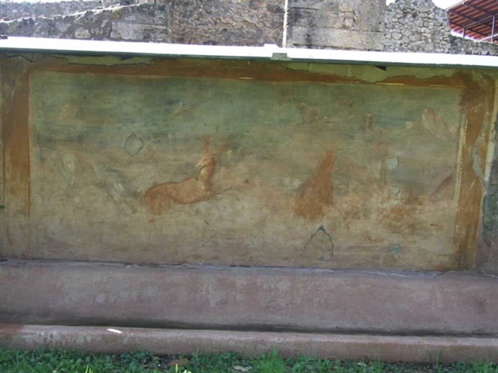 V.5.3 Pompeii. March 2009. Room 7, painting on west side of peristyle – 
Painting 6 - Animal painting showing to the right, a bear standing on his rear legs eating the fruits from a tree. Then to the right, near a bridge, a statue of Priapus near to which was a round altar. On the left, a deer being pursued by a dog. See Not. Scavi, 1899, p.349, number 4.