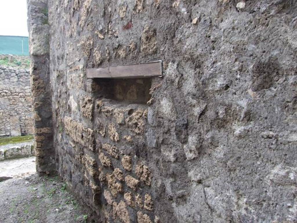 V.5.4 Pompeii.  March 2009.   West wall of shop.