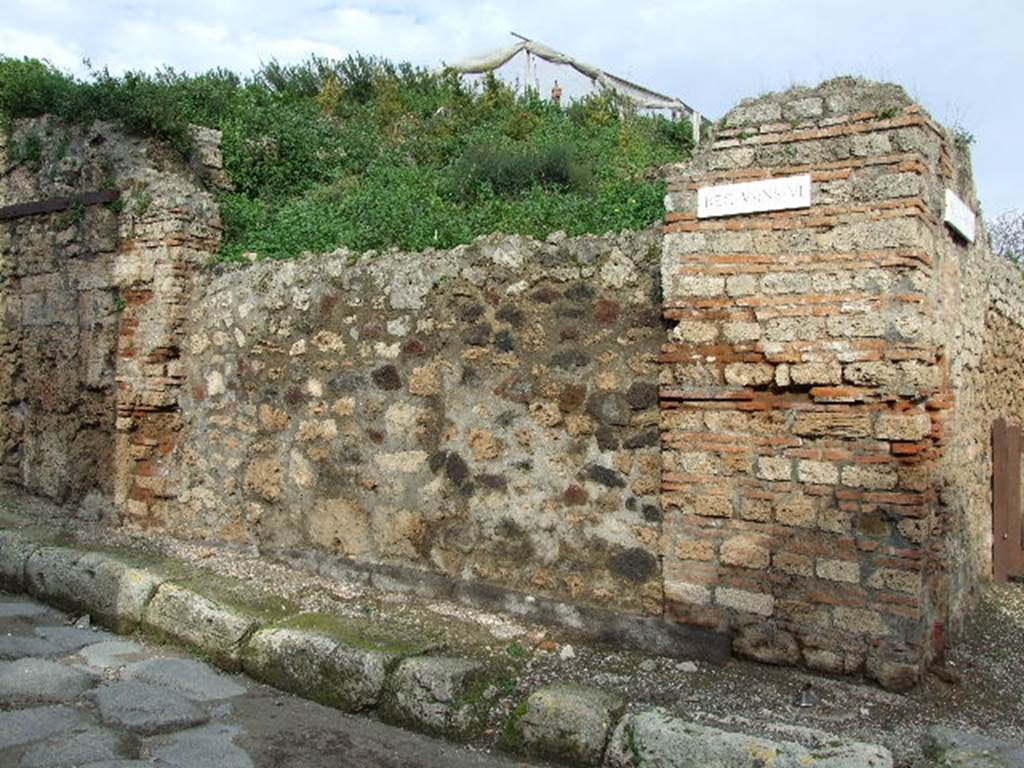 V.6.1 Pompeii. December 2006. Photo showing entrance to shop.  The pillar on the right used to have a painting of Bacchus.  The pillar on the left used to have a painting of Mercury.  See Fröhlich, T., 1991, Lararien und Fassadenbilder in den Vesuvstädten.  Mainz: von Zabern.  (F34: p.318).  According to Garcia y Garcia, the loss of these paintings was attributable to the bomb that fell in the road here on the night of 16 September 1943. The paintings were photographed at the time of Sogliano, around 1906, and also by Tatiana Warscher, pre 1943. 
These can be seen in Garcia y Garcia, L., 2006. Danni di guerra a Pompei. Rome: L’Erma di Bretschneider. (p. 66).
