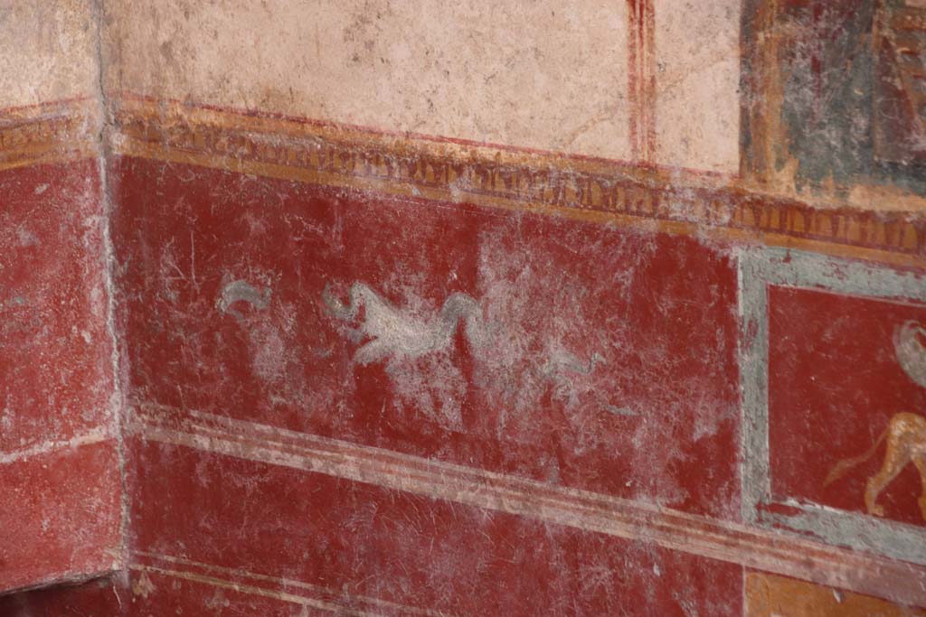 V.6.12 Pompeii. October 2020. Amb. 9. Painted dolphin and sea creature in zoccolo/dado at east end of south wall. Photo courtesy of Klaus Heese