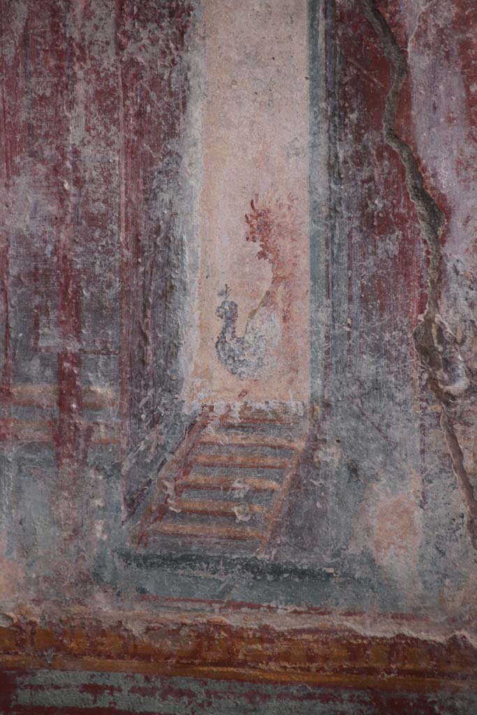 V.6.12 Pompeii. October 2020. Amb. 9. 
Detail from architectural decoration (? a peacock) on west side of central painting on south wall of cubiculum.
Photo courtesy of Klaus Heese.