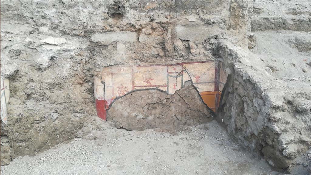 V.7.1 Pompeii. April 2018. Room with cupid decorations, north wall under excavation, with possible opening at left end of wall.
Photograph © Parco Archeologico di Pompei.
