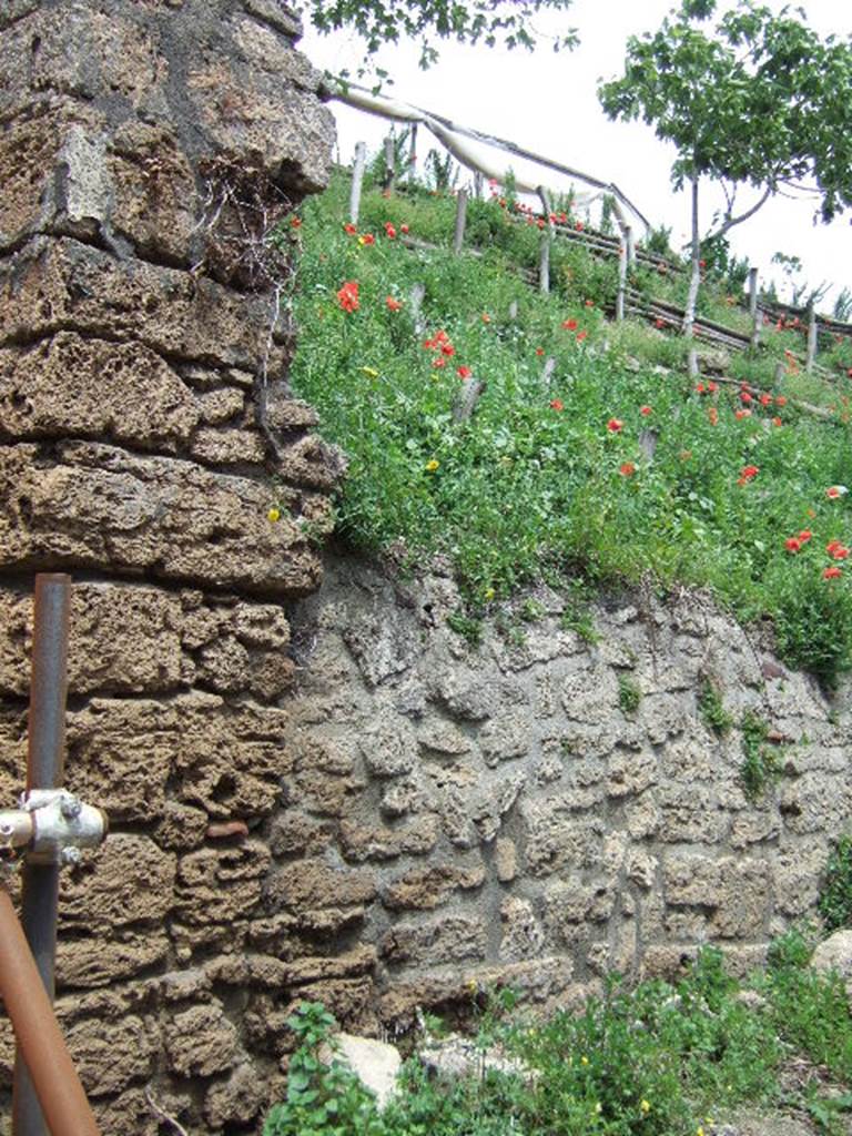 V.7.1 Pompeii. May 2006. Corner of insula on east side of roadway.