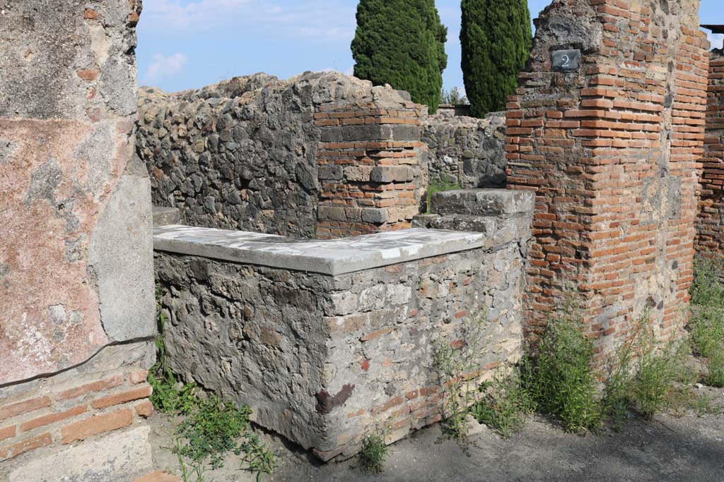 VI.1.2 Pompeii. December 2018. 
Looking towards counter on south side of entrance doorway. Photo courtesy of Aude Durand.