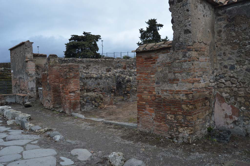 VI.1.4 Pompeii. March 2019. Looking north-east on Via Consolare to entrance doorway, in centre and towards VI.1.2, on left. 
Foto Taylor Lauritsen, ERC Grant 681269 DÉCOR.