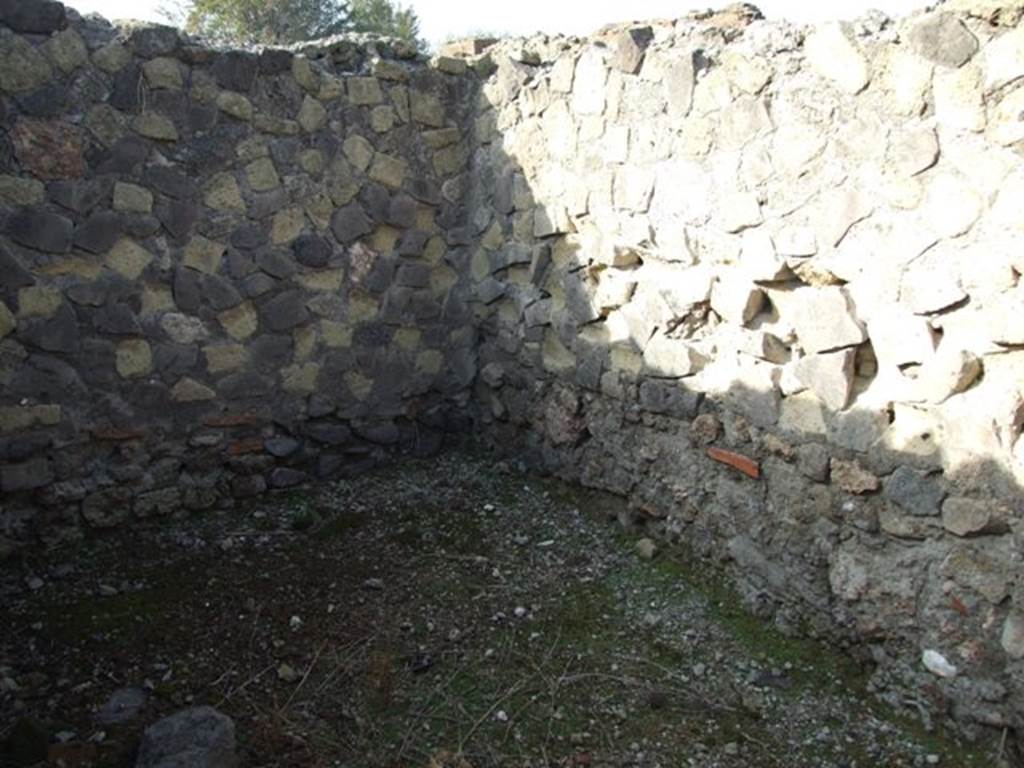VI.1.7 Pompeii. December 2007. Room 6, looking to north-west corner.
According to Boyce, there was an arched niche in a small room located near the kitchen. It was in the north wall. Its walls were coated with a fine white stucco and decorated with coloured spots, some green some red. The niche was set near the east end of the north wall, directly opposite the entrance doorway. This complex of rooms was reached from the south-west corner of the atrium of number 25. See Boyce G. K., 1937. Corpus of the Lararia of Pompeii. Rome: MAAR 14.  (p.43, no.134)