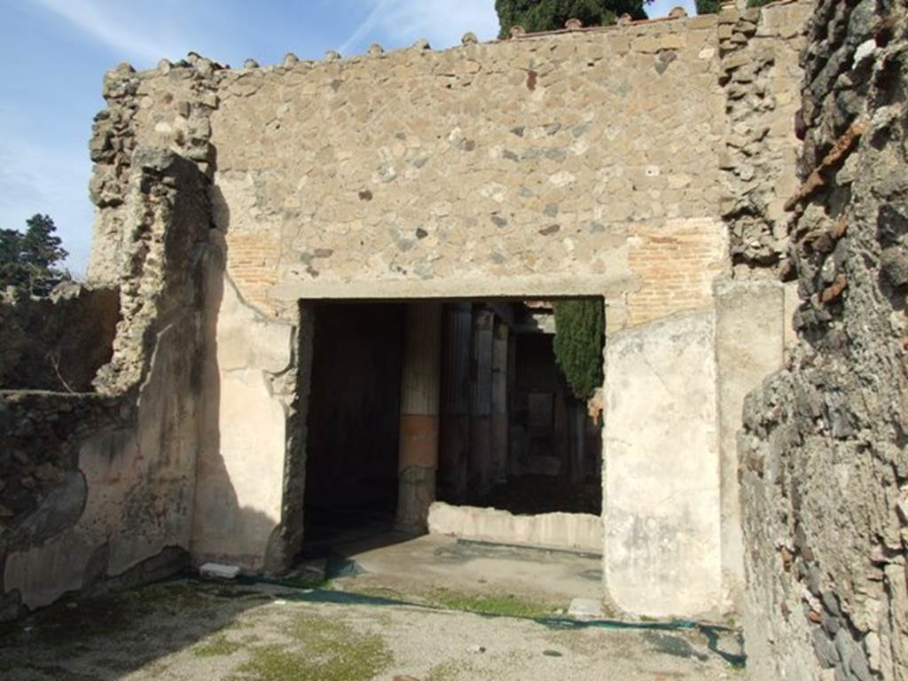 VI.1.7 Pompeii. December 2007. Room 10 looking north into room 13, the peristyle.
According to Jashemski, to the right (north) of the atrium of house 25 (excavated in 1828) was a peristyle garden. The triclinium off the south-west corner of the portico had a good view of the garden.
See Jashemski, W. F., 1993. The Gardens of Pompeii, Volume II: Appendices. New York: Caratzas. (p.119)
According to PPP and PPM, the zoccolo on the west wall was yellow and the middle area of the wall would have been red. At the north end of the west wall, the remains of a painted column could just about be seen. The floor of this room was only preserved on the north side of this room showing part of the threshold of the doorway leading to the peristyle. The threshold was decorated with tesserae forming black and white triangles (‘pale di mulino’), a motive typical of the II style. Of the same epoch, could have been also the threshold of black and white mosaic decorated by two black mosaic dolphins, with an anchor in the middle, (see PAH 1, 2, p.22), however this was not preserved.
In the centre of the floor, in view of the doorway, was a square of 0.33m in size, and inside of this was a circle formed by pieces of glass, and inside that there was a solitary piece of glass forming a circle, like a circular mirror. Around this, there were many four and five sided pieces that decorated it, each of these with various work inside, but all of glass and paste of various colours, but many were worn away.
See Bragantini, de Vos, Badoni, 1983. Pitture e Pavimenti di Pompei, Parte 2. Rome: ICCD. (p.107 ‘triclinio 37’)
See PAH, 1, 2, (p.21-22) – 22nd July 1784.
