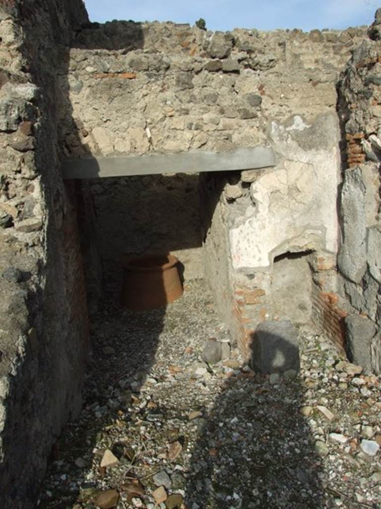 VI.1.7 Pompeii. December 2007. Room 24, baths’ services area, looking north from room 28.
? area of steps to upper floor, possibly the ones bombed in 1943?