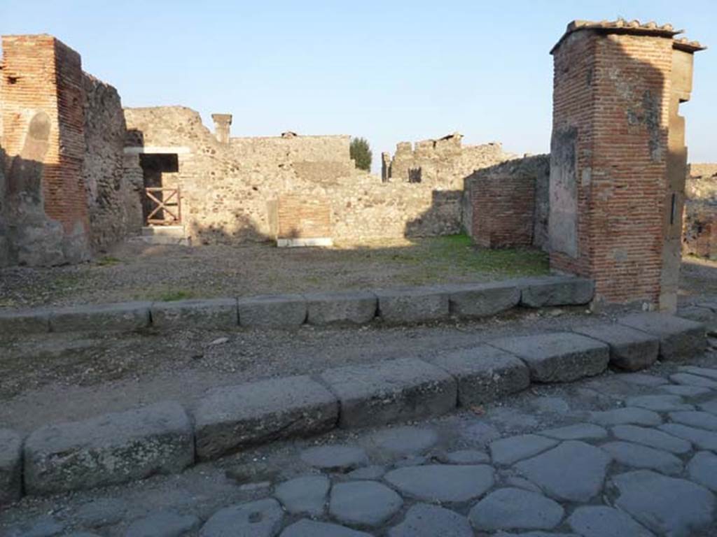 VI.1.13 Pompeii. October 2012. Looking east on Via Consolare. Photo courtesy of Michael Binns.