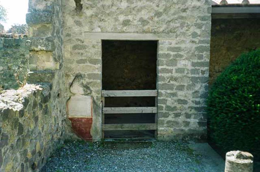 VI.2.4 Pompeii. June 2010. Doorway to cubiculum in south-east corner of garden apartment. Photo courtesy of Rick Bauer.
It should be noted that, apart from the west side, the house was entirely destroyed by the bombing during the night of 14/15th September 1943. 
According to Laidlaw, the roof, the south apartment, and the portico behind the main house block are almost completely modern reconstructions made in 1970-71.
See Garcia y Garcia, L., 2006. Danni di guerra a Pompei. Rome: L’Erma di Bretschneider. (p. 66-74)