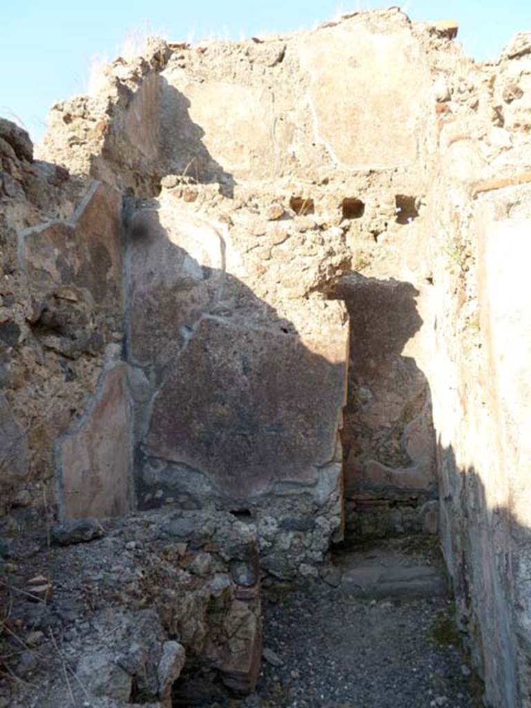 6.2.10 Pompeii. May 2011. Looking east across kitchen, towards latrine and east wall, with remains of upper room. Photo courtesy of Michael Binns.