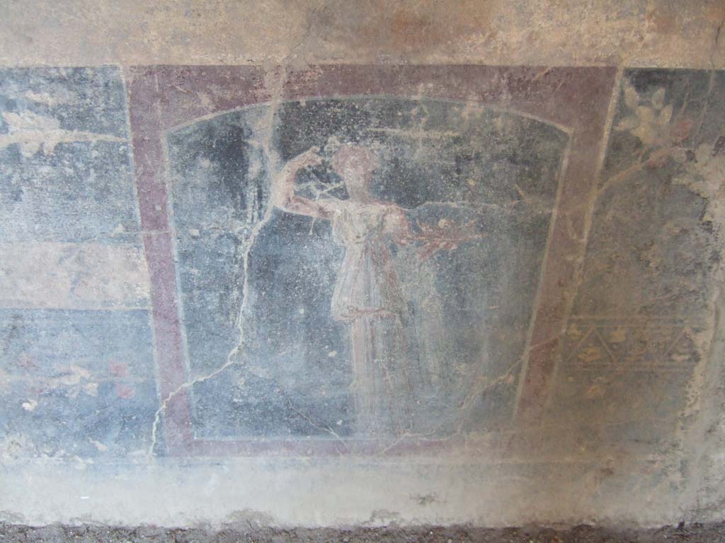 VI.2.14 Pompeii. September 2005. Lower north wall of triclinium towards east side..
