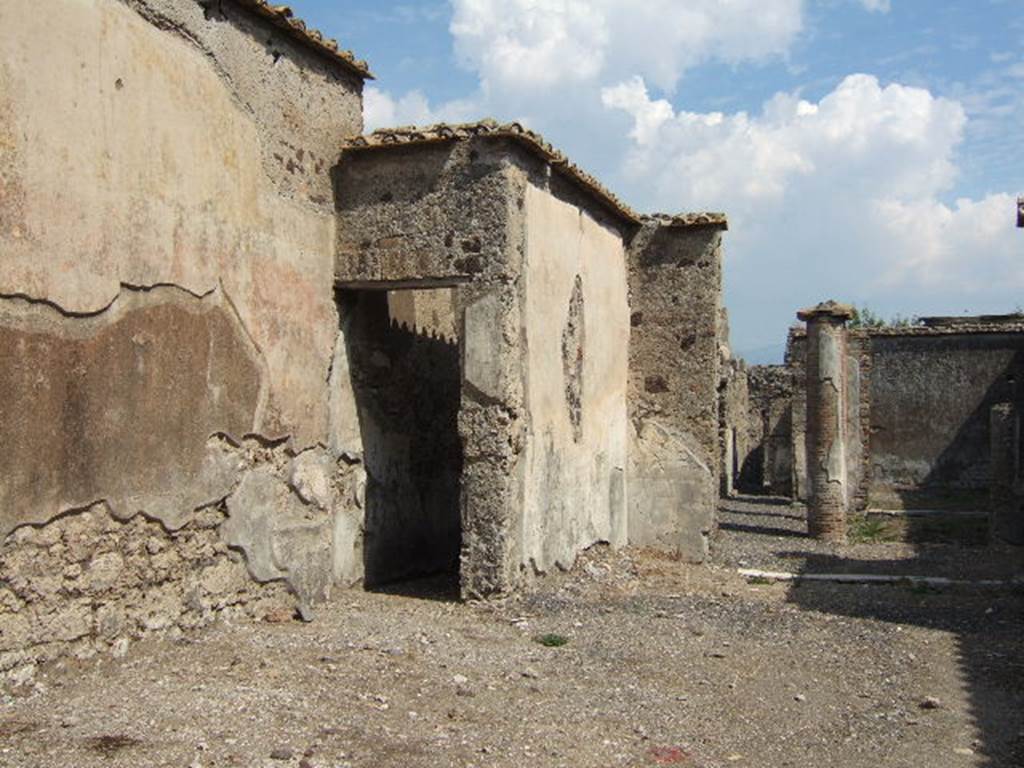 VI.2.16 Pompeii. September 2005. Looking east across atrium towards north wall of atrium and tablinum.  The doorway led into a corridor which served as a passageway to the garden area.
See Pappalardo, U., 2001. La Descrizione di Pompei per Giuseppe Fiorelli (1875). Napoli: Massa Editore. (p.51)