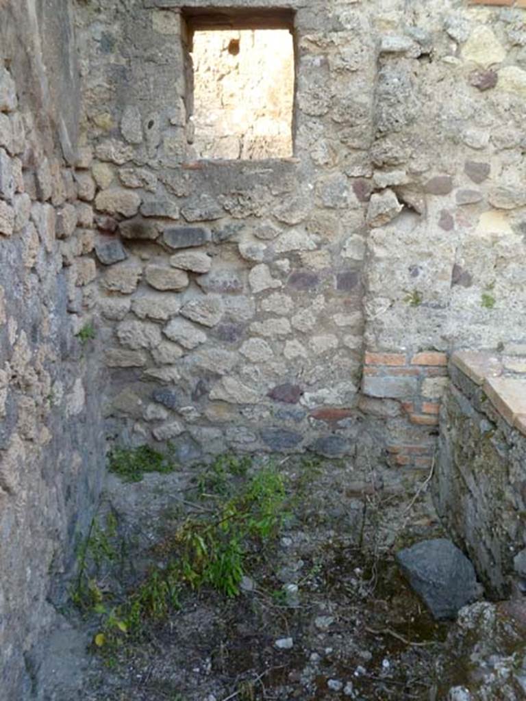 VI.2.16 Pompeii. May 2011. North-east corner of kitchen, perhaps with a latrine. According to Hobson, an area in the kitchen with a low wall, on which a screen might have been stood and again with a window, suggested the position of a latrine. He also considered the narrow room with a step up over a threshold stone, on the south side of the atrium, was possibly a latrine. Either or both could have been a latrine.
See Hobson, B., 2009. Latrinae et foricae: Toilets in the Roman World. London; Duckworth. (p.68)