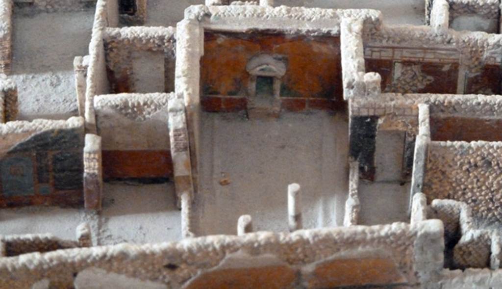 VI.2.15 Pompeii. May 2010. Looking south towards Lararium on south wall of peristyle. Model as viewed in Naples Archaeological Museum.