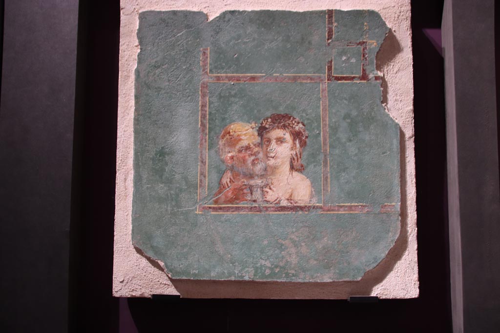 VI.2.22 Pompeii. October 2022. 
Wall painting of the Maenad embracing an old Silenus and offering him a silver drinking cup filled with wine. SAP 17713. 
This was originally part of a larger wall panel.  Photo courtesy of Klaus Heese.