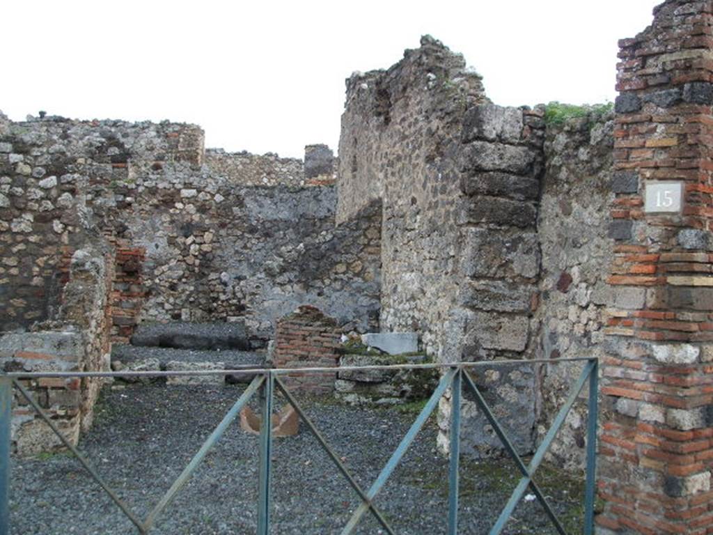 VI.3.15 Pompeii. December 2004. Looking east from Via Consolare.
According to CTP, CIL IV 108 was found here. Howvere, they say Zangemeister located it on the west side (left) of VI.3.20. See Van der Poel, H. B., 1983. Corpus Topographicum Pompeianum, Part II. Austin: University of Texas. (p.249) According to Epigraphik-Datenbank Clauss/Slaby (See www.manfredclauss.de), it read – C(aium) I(ulium) P(riscum) IIvir(um)
On the left can be seen the rear room of the shop, possibly a cubiculum.
On the right near the terracotta remains of a puteal, remains of another room with steps. In the area behind the steps would have been the latrine In the middle a corridor to the rear. At the rear would have been another room, a triclinium or workshop?.  See Eschebach, L., 1993. Gebäudeverzeichnis und Stadtplan der antiken Stadt Pompeji. Köln: Böhlau. (p.164) See Pappalardo, U., 2001. La Descrizione di Pompei per Giuseppe Fiorelli (1875). Napoli: Massa Editore. (p.53)