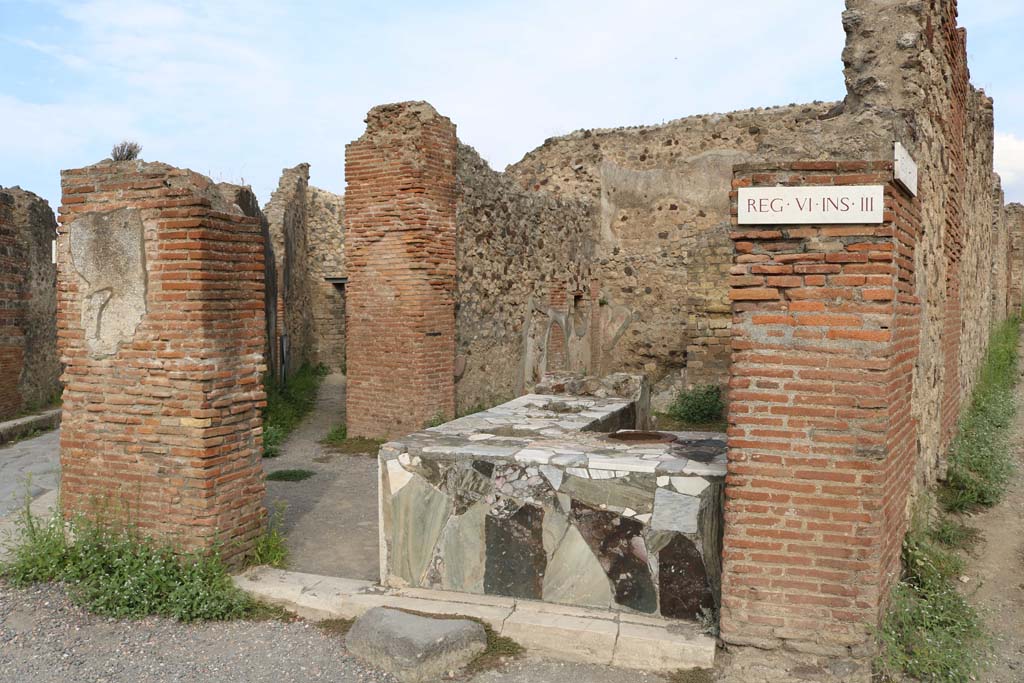 VI.3.20/1918 Pompeii. December 2018. 
Looking north-west from VI.3.20. across VI.3.19 towards doorway/corridor into VI.3.18. Photo courtesy of Aude Durand.