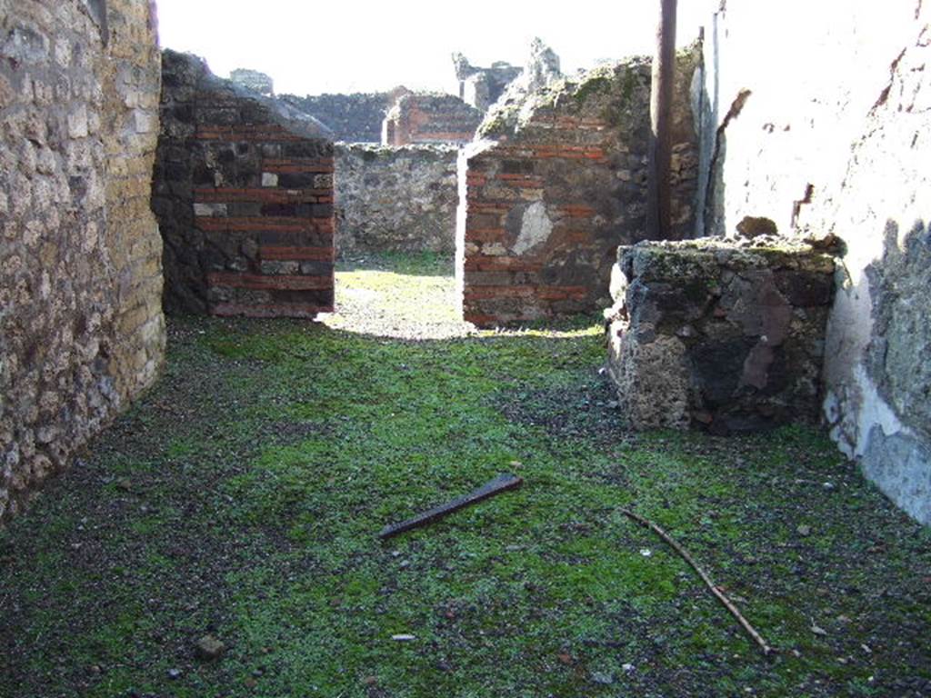 VI.3.22 Pompeii. December 2004. Looking west into wide shop or workshop?
On the north side (right) can be seen steps to upper floor.