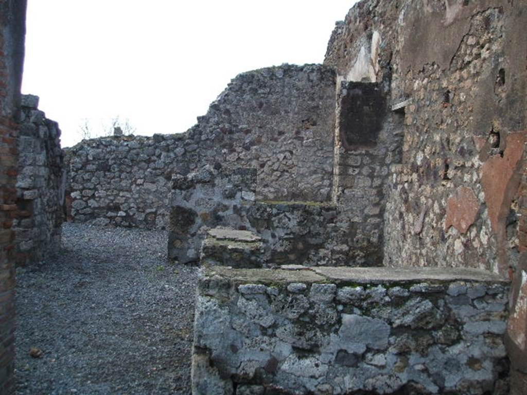 VI.3.24 Pompeii. December 2005.  Looking west across counter towards large room for the customers, at the rear.