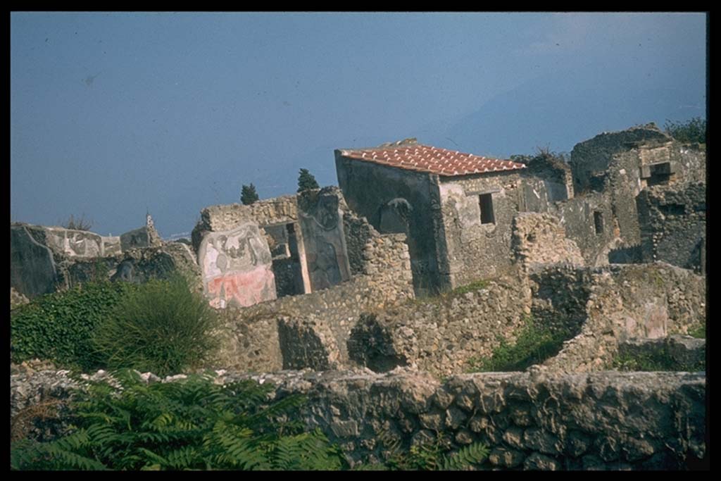 VI.5.3 Pompeii. Looking south-east from the walls, across corner of VI.2, to road and entrance doorway of VI.5.3.
Photographed 1970-79 by Günther Einhorn, picture courtesy of his son Ralf Einhorn.