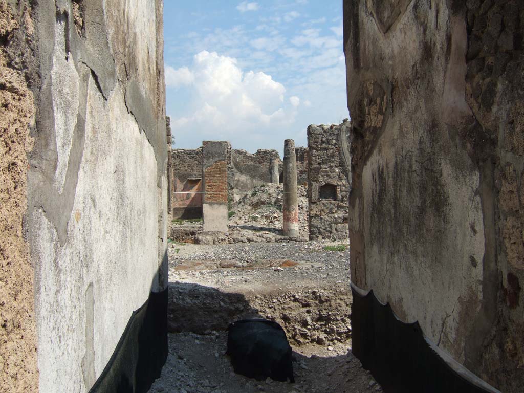 VI.5.5 Pompeii. September 2005. Entrance corridor, looking east to peristyle.  
Since 2005, this house has been re-examined, and limited excavations have taken place below the 79AD level.
See http://www.fastionline.org/micro_view.php?fst_cd=AIAC_141&curcol=main_column .