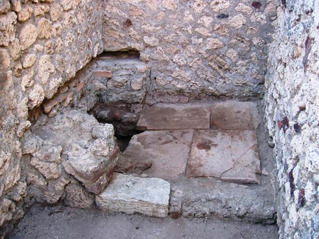 VI.5.8 Pompeii. July 2005. Photo courtesy of Barry Hobson.
According to Hobson, this latrine had two large pedestals. It also had a slot in both the rear wall and the north wall into which the wooden seat would have fitted.
See Hobson, B., 2009. Latrinae et foricae: Toilets in the Roman World. London; Duckworth. (p.49 and fig.63)