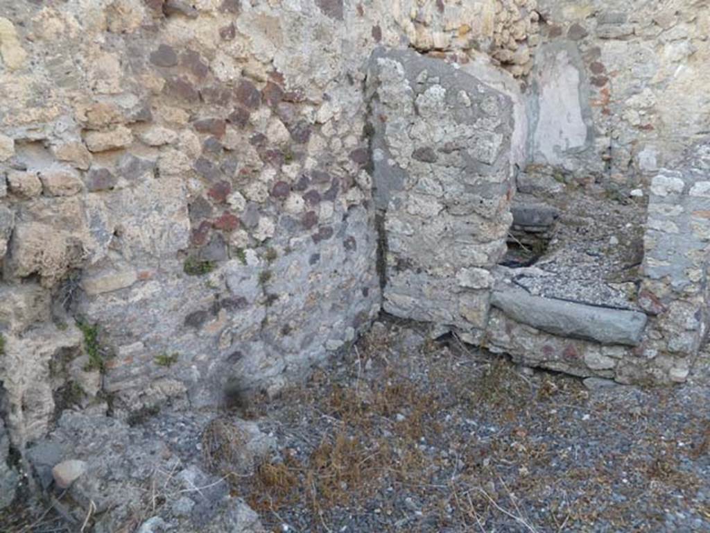 VI.5.9 Pompeii. May 2011. Doorway to latrine/small room in north-east corner of kitchen area.
According to Hobson, “As a result of the lack of preservation of wood in Pompeii, no doors have been found for latrines. 
However, a large percentage of latrine rooms have threshold stones which may have grooves into which door posts were set. 
Many of the rooms have a step up from the floor of the corridor or outer room. 
This not only serves to differentiate the cubicle from other rooms, but also allows for the tile system to drain efficiently under the toilet seat.”
See Hobson, B., 2009. Latrinae et foricae: Toilets in the Roman World. London; Duckworth. (p.82 and fig.105, showing grooves for doorposts).