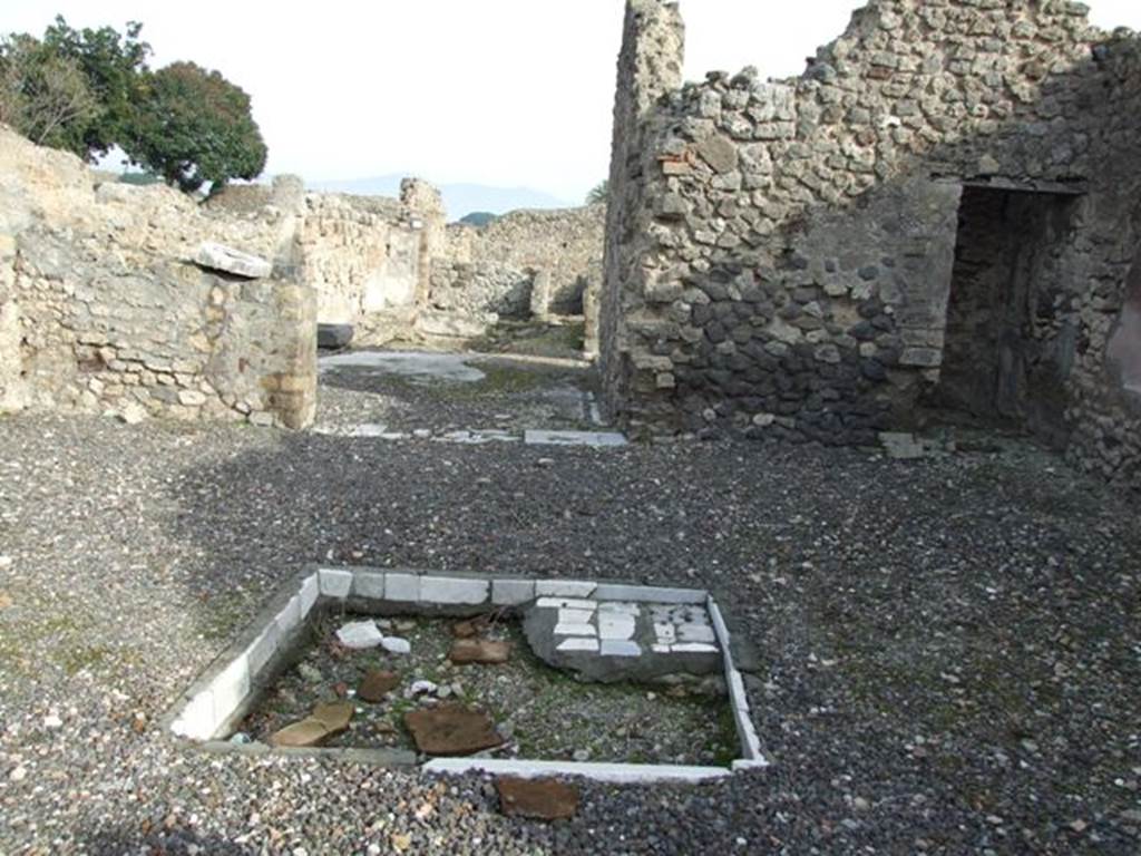 VI.5.9 Pompeii. December 2007. Looking east across atrium towards tablinum. East side of atrium and doorway to room in south-east corner of atrium.