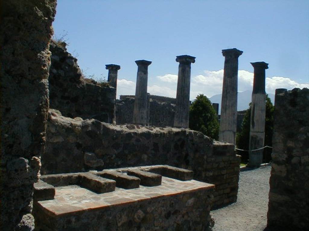 VI.6.1 Pompeii. May 2004. Room 16, looking east across reconstructed hearth in kitchen.