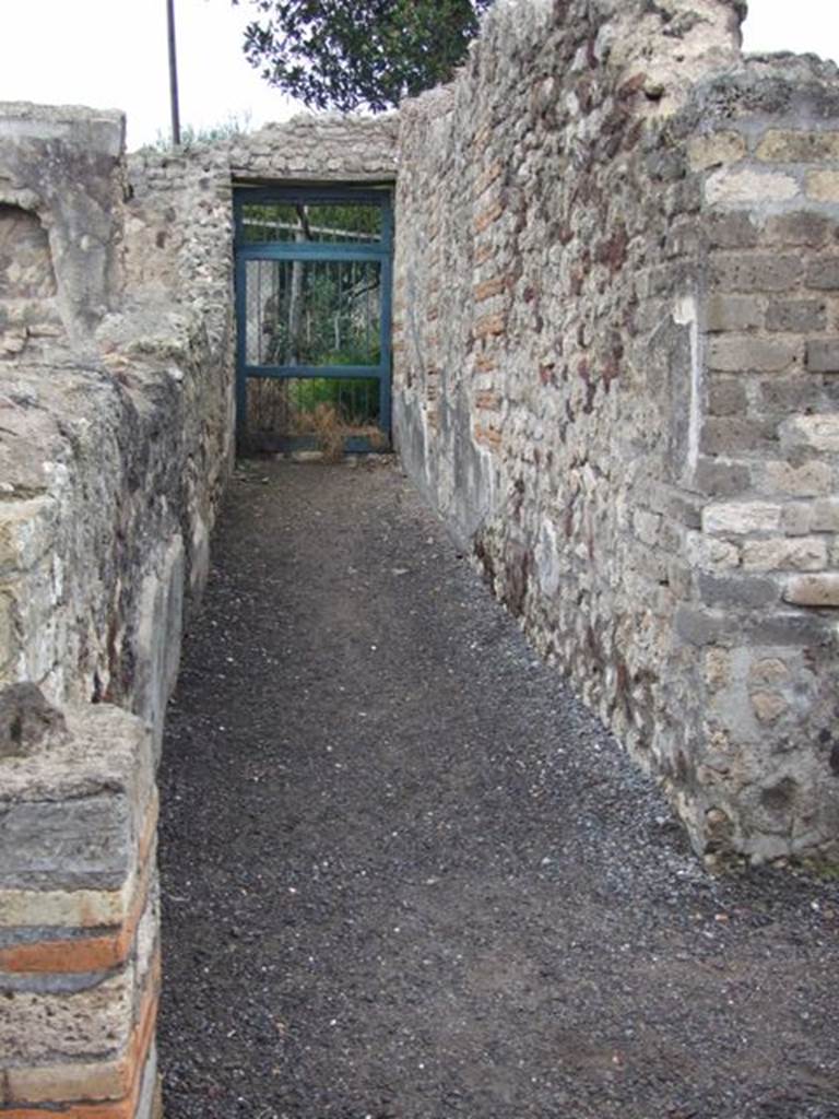 VI.6.1 Pompeii. December 2007. Room 18, looking north along corridor leading to kitchen garden area.