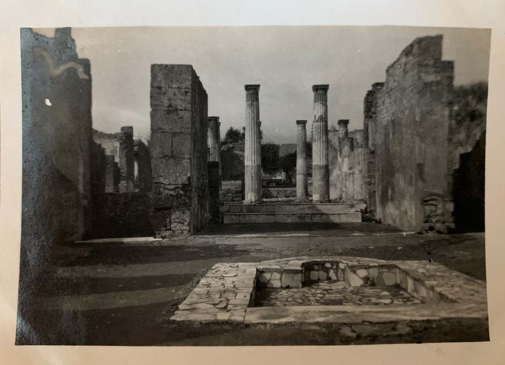 VI.6.1 Pompeii. March 1922. Looking north across impluvium in atrium towards tablinum and peristyle.
Photo courtesy of Rick Bauer.