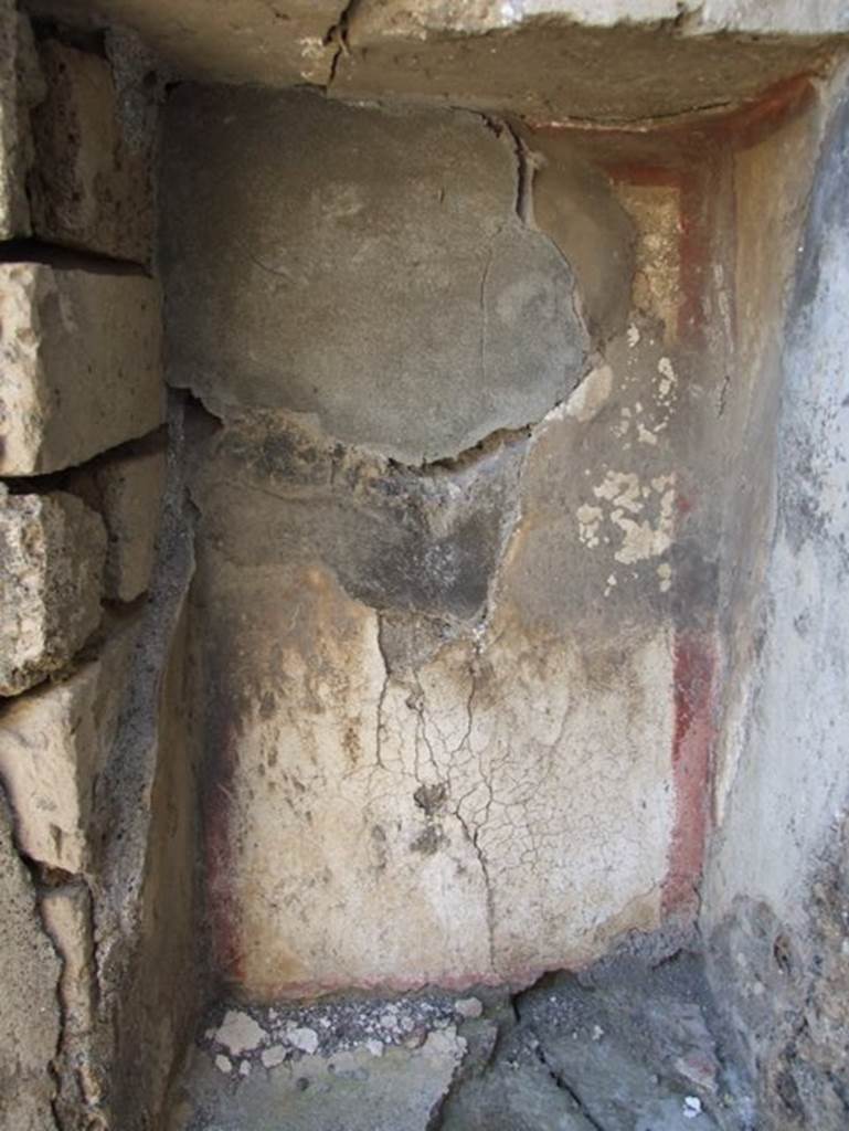 VI.7.3 Pompeii. March 2009. Room 5, tablinum. Detail in recess on west side of cupboard.