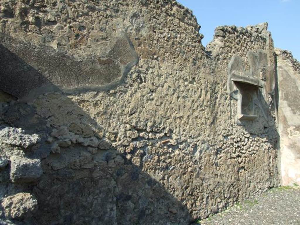 VI.7.3 Pompeii. March 2009. Room 1, north wall of atrium, with niche.
According to Fiorelli, under the niche was found an alphabet written by a child of the house, still getting used to writing his letters- AXBVC
See Pappalardo, U., 2001. La Descrizione di Pompei per Giuseppe Fiorelli (1875). Napoli: Massa Editore. (p.57)