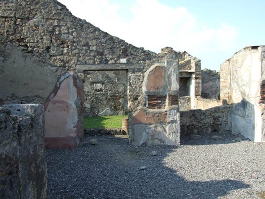 VI.7.6 Pompeii. March 2009. Room 1, atrium, looking north to doorway to south portico of the garden area, at the side of the small tablinum. Through the window in the rear wall of the tablinum, can be seen the site of the wide window of the triclinium. According to Jashemski, the tablinum and the triclinium had a wide window looking out onto the garden area. See Jashemski, W. F., 1993. The Gardens of Pompeii, Volume II: Appendices. New York: Caratzas. (p.129)
