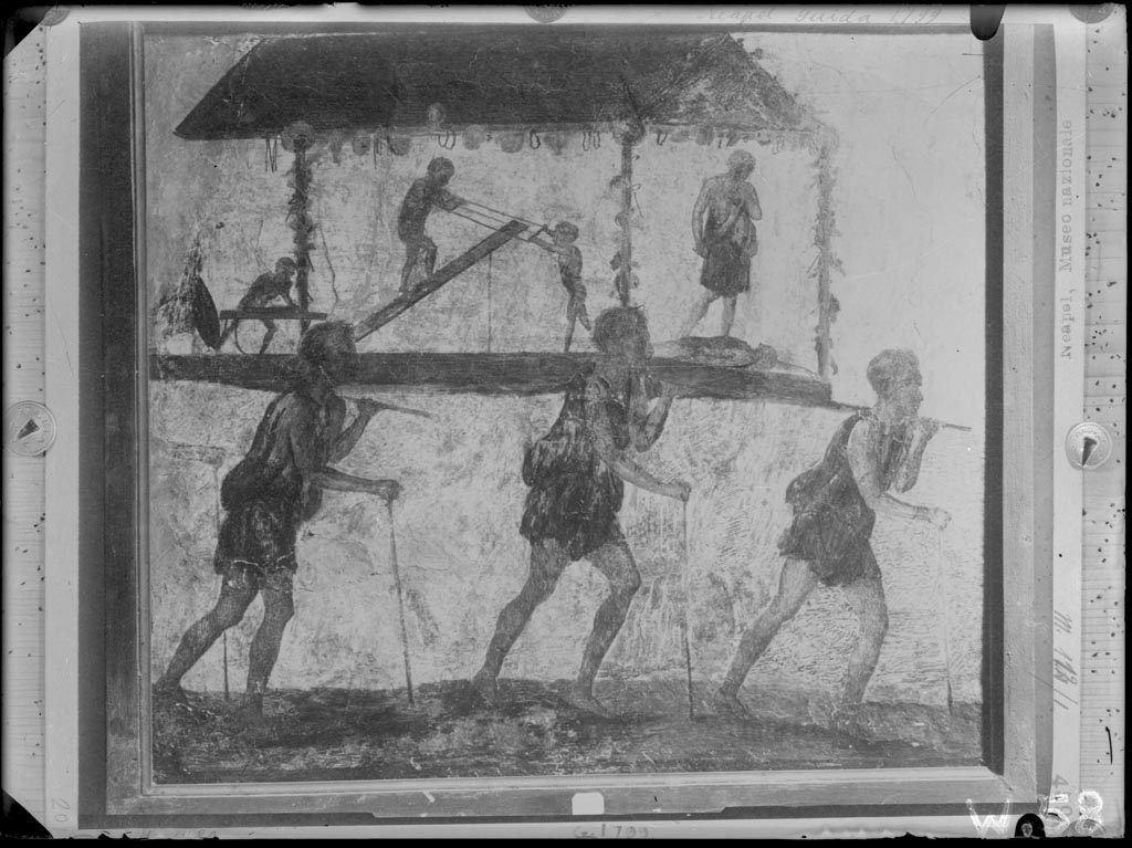 VI.7.9 Pompeii. W.58. Wall painting of the Procession of the Carpenters, originally found on pilaster between entrances VI.7.8 and VI.7.9.
Now in Naples Archaeological Museum. Inventory Number 8991. 
Photo by Tatiana Warscher. Photo © Deutsches Archäologisches Institut, Abteilung Rom, Arkiv.