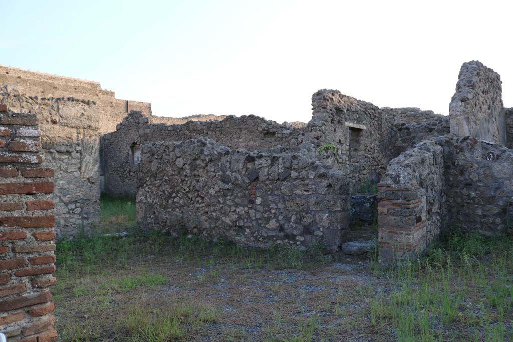 VI.7.11 Pompeii. December 2018. 
Looking south-west from entrance doorway, towards atrium of VI.7.9, showing niche in south ala, centre left. Photo courtesy of Aude Durand.